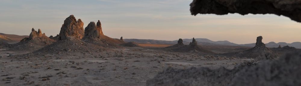 Sun strikes the spires rising from the dry lake bed.