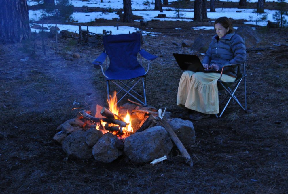 Yes, I am blogging by the campfire. In a skirt. And a down jacket.
