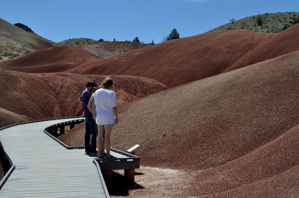 Miguel, Diego, and Tara along the boardwalk on the Painted Cove Trail