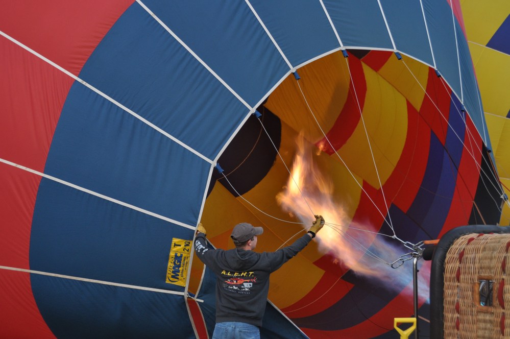 One of my fellow passengers holds back the cords to keep them from burning up