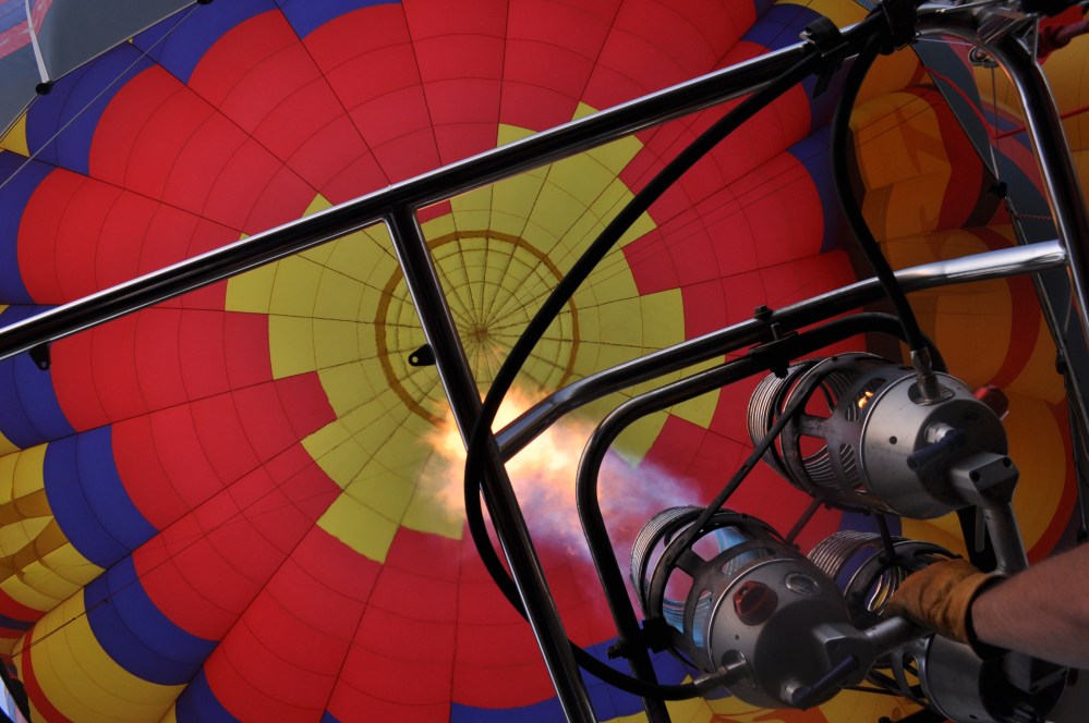 The burner spitting fire into the balloon