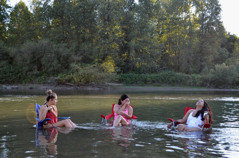 These ladies carried their chairs down from the highway, walked directly into the river, sat down and began gossiping. "...and I was like, 'you can't expect me to forgive you after what you did.' And he said..." They were wonderful.
