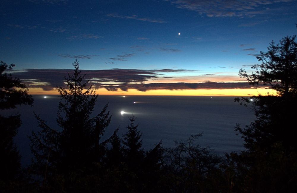 Fishing boats lit up off the northern California coast, called "the North Coast" by locals.