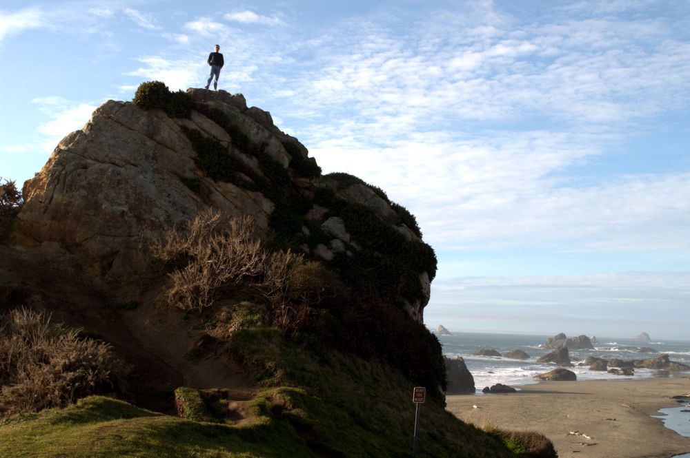Arno on top of a rock at a southern Oregon beach