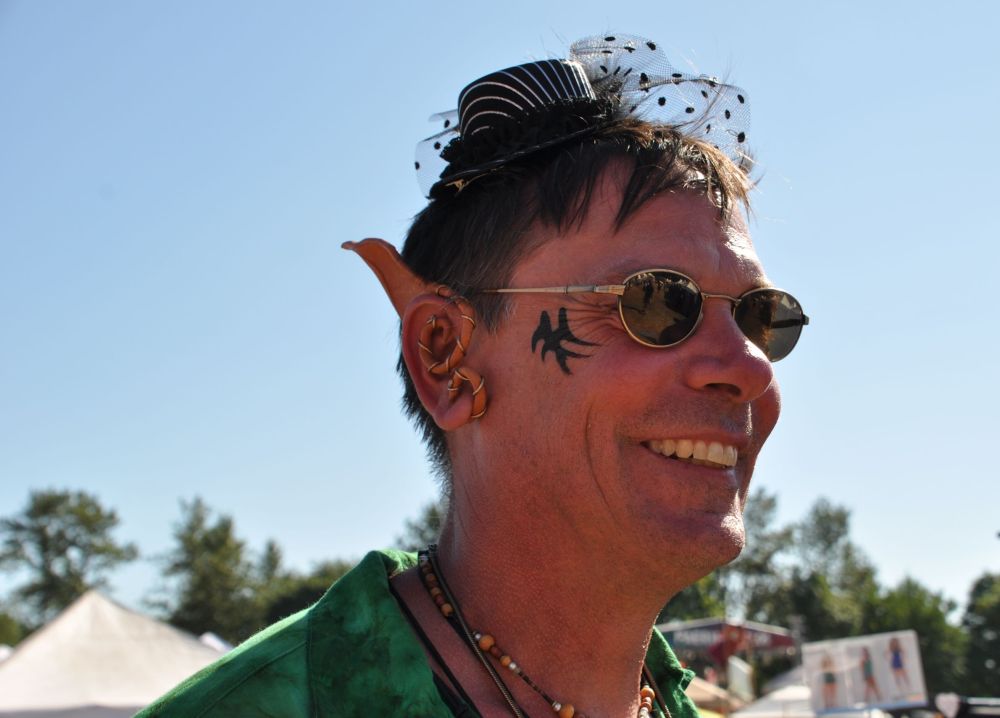 Happy in large ears and small hat.