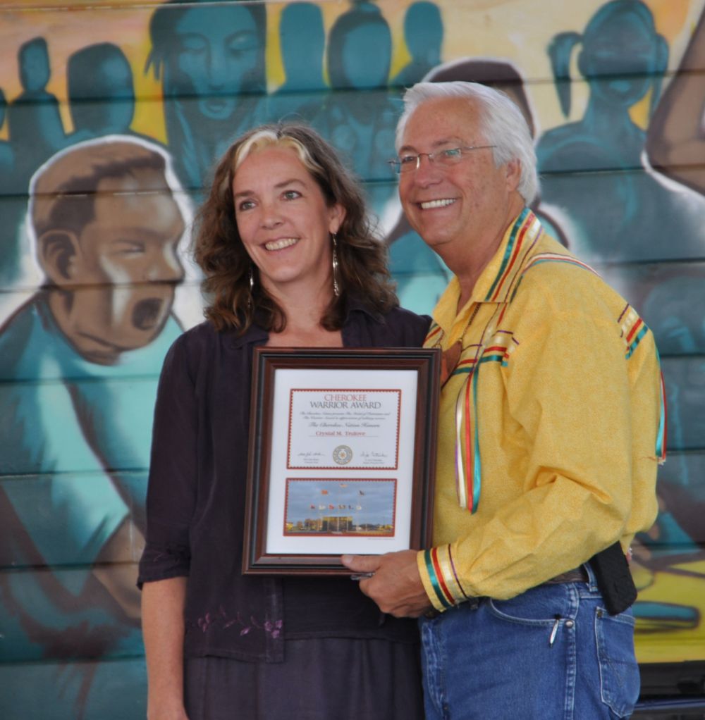 I am standing with Chief Baker as he presents the Cherokee Warrior Award.