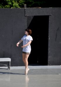 Tara, before the show. The shank is going out in her pointe shoes, so she is testing another pair to see if they are in better shape.