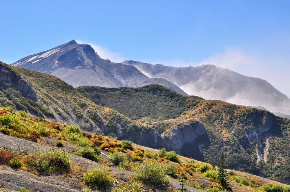 Ash kicked into the air as high winds tornado into the crater.