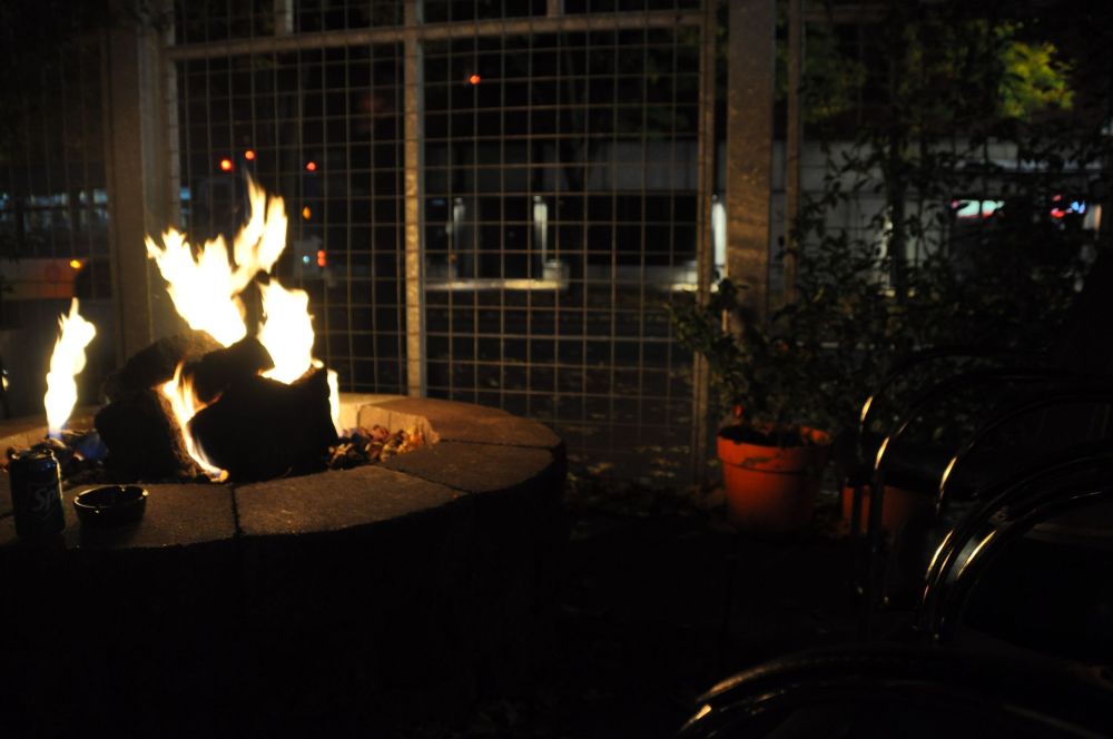 Enjoy the fire, a drink, a smoke, and watch people walk by on the street.