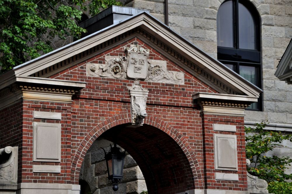 Veritas, the Harvard logo meaning "truth," above a boar's head. 