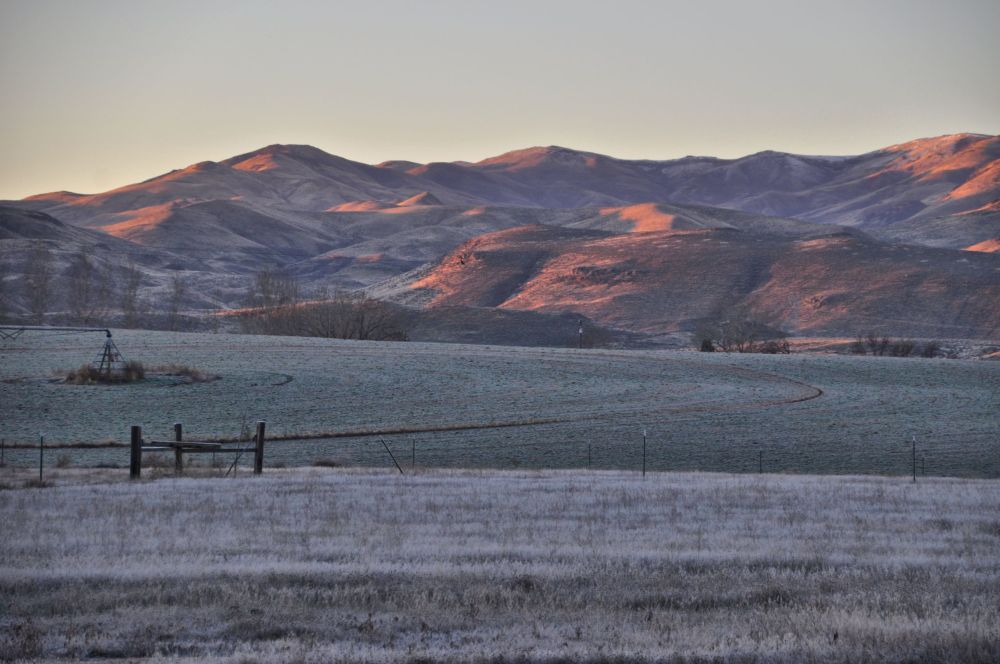 Mountains blush in the morning light.