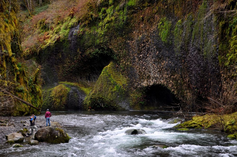 The area above Lower Punchbowl Falls has a rocky beach area that can hold a lot of people who want to enjoy the shade and cool breezes in the summer. In February, there's just a guy taking pictures of his girl. :-)