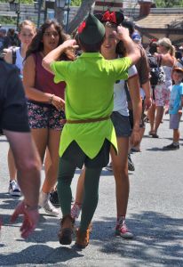 Peter Pan has adoring fans. Just catch a load of the face on this girl as she realizes who is walking toward her.