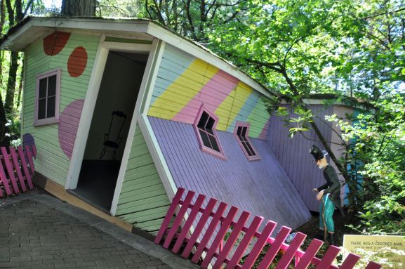 The Crooked Man invites visitors to walk through his crooked house.