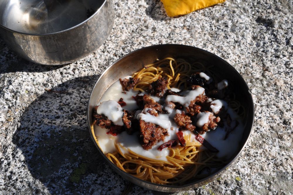 The final meal. The pasta has a dark colour because I boiled it in the same pan in which I cooked the sausage. That made the water brown, but oh so flavourful.