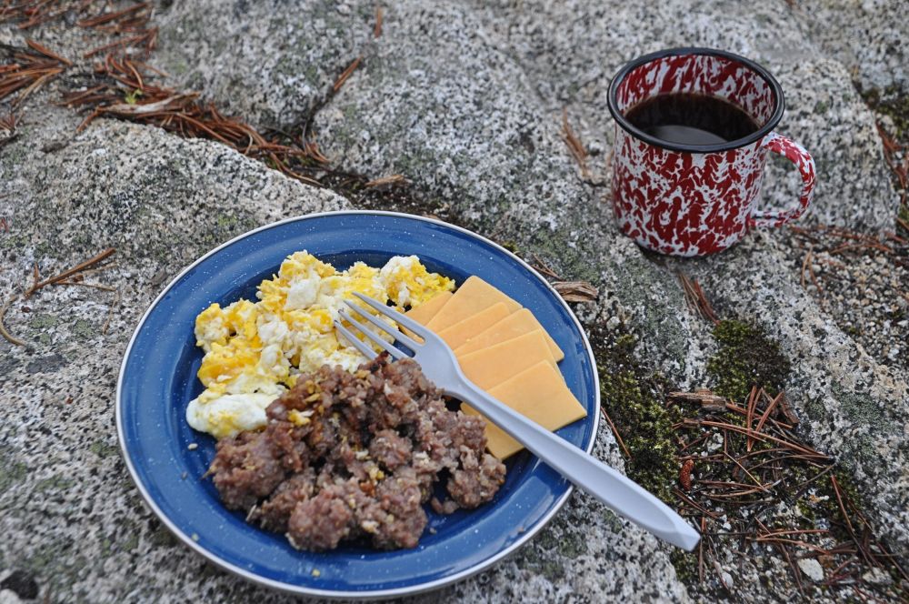 Roughing it? Says who? I do breakfasts too. Here you see the remainder of the sausage, scrambled eggs, sliced cheese and coffee (in the coffee/wine/alfredo all-purpose tin cup).