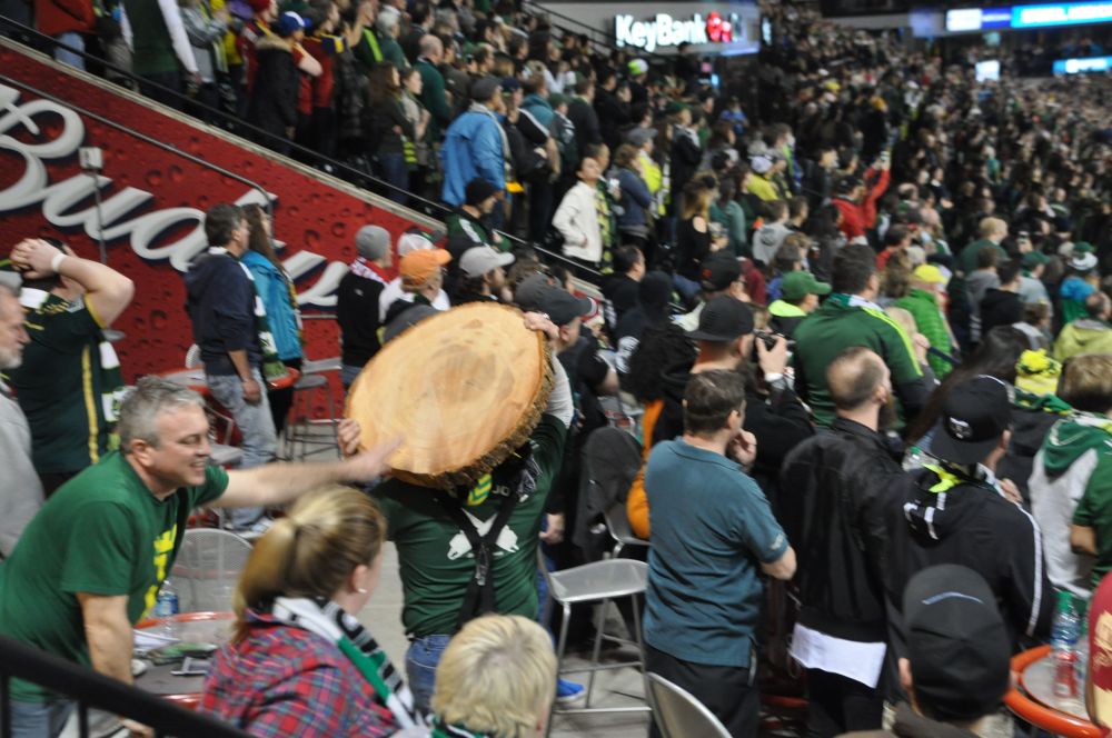 Here, Jim hauls the wooden disc through the crowd so people can touch it.