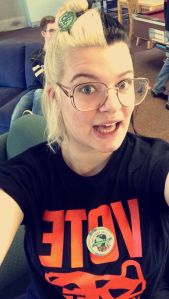 Tara voted for the first time in the Oregon primaries. This is a photo of Tara volunteering to get other college students registered to vote.