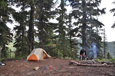 Our new camp site on a ledge, and D getting the fire going.