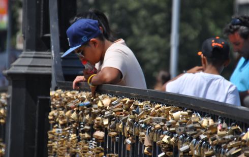 Bridge at the bottom of the hill covered in locks of love.