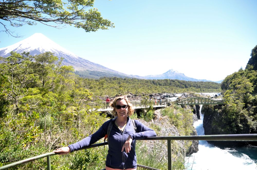 Me in front of volcanoes and waterfalls.