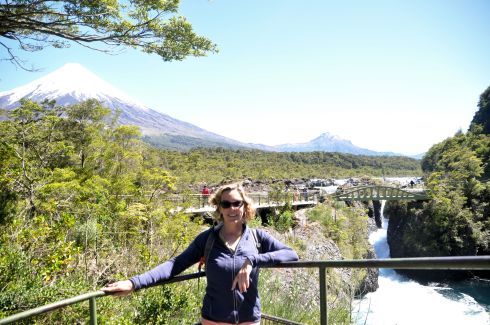 Me in front of volcanoes and waterfalls.