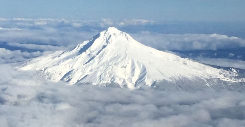 My favourite volcano of them all was back home in Oregon. Here, Mt. Hood rises from the clouds as we approach Portland.